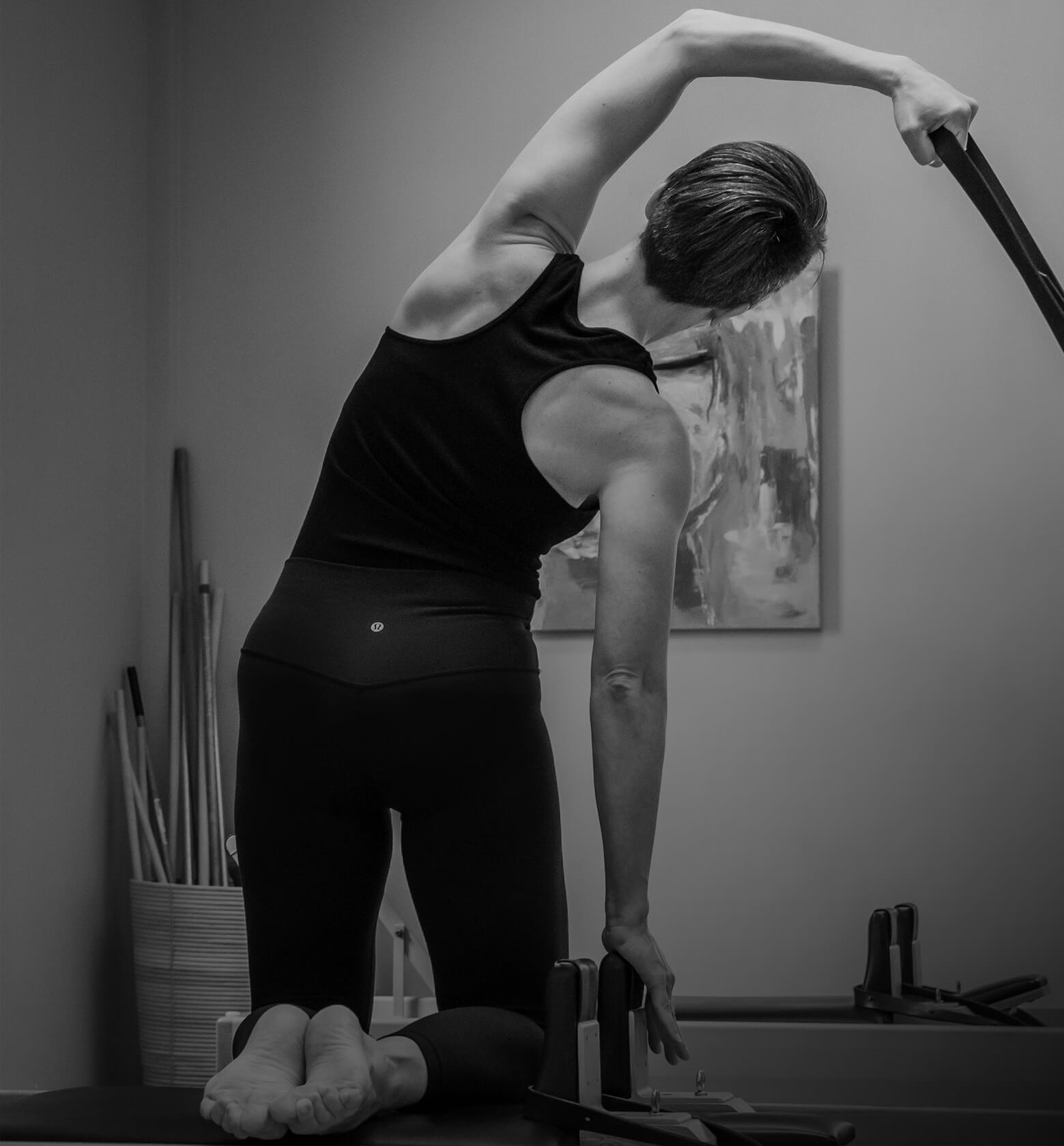 Pilates side stretch on reformer